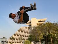 Achref Bejaoui, 25, performs parkour, a sport that originated in France in the 1990s, which involves getting around urban obstacles with a fast-paced mix of jumping, vaulting, running and rolling, in the Qatari capital Doha, on August 11, 2020. Parkour, also known as free-running, has now found a small but committed following in Qatar despite evening temperatures that hover around 40 degrees Celsius (104 Fahrenheit) in summer and over-zealous security guards unfamiliar with the sport. KARIM JAAFAR / AFP