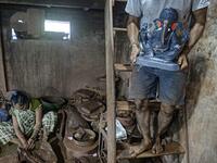 In this picture taken on August 15, 2020, an artisan carries a clay idol of elephant headed Hindu god Ganesha at Muslim potter Yusuf Zakaria Galwani's workshop at Kumbharwada inside the Dharavi slums in Mumbai. After the coronavirus pandemic clobbered his pottery business, a Muslim artisan from India's largest slum turned to a Hindu god to revive his fortunes by making environmentally-friendly Ganesha idols for an upcoming festival. In Mumbai's Dharavi slum, Galwani worked alongside his two brothers to crea