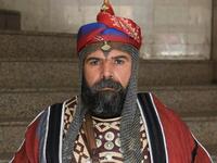 An Ashura re-enactor poses for a picture while dressed in costume as Shiite Muslims prepare to re-enact events of Ashura in the central Iraqi holy shrine city of Karbala on August 22, 2020. Ashura is a period of mourning in remembrance of the seventh-century martyrdom of Prophet Mohammad's grandson Imam Hussein, who was killed in the battle of Karbala in modern-day Iraq, in 680 AD. Mohammed SAWAF / AFP