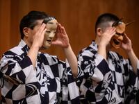 This photo taken on July 29, 2020 shows performer Kanta Nakamori (L) and his son Kennosuke Nakamori putting on masks as they take part in a rehearsal at the Kamakura Noh Theatre in the town of Kamakura in Kanagawa Prefecture, about one hour southwest of Tokyo. PHILIP FONG / AFP