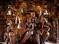 This photograph taken on September 1, 2020 shows the family statue with the portraits of the Thai businessman Lek Viriyaphan, who designed the temple, and his wife Prapai Viriyaphan in the all wooden Sanctuary of Truth Hindu-Buddhist temple and museum in Pattaya. Mladen ANTONOV / AFP