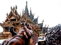 This photograph taken on September 2, 2020 shows wooden carvings in front of the all wooden Sanctuary of Truth Hindu-Buddhist temple and museum in Pattaya. Mladen ANTONOV / AFP
