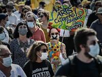 A protester wearing a face mask holds a sign reading "To arts citizen, free the creation" as they take part in a demonstration called by the "Yellow Vest" (Gilets Jaunes) movement in Bordeaux, southwestern France on September 12, 2020. Philippe LOPEZ / AFP