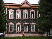 A woman walks past a traditional wooden house in the Siberian city of Tomsk on September 8, 2020. Tomsk is considered to be one of the oldest towns in Siberia founded in 1604. Wooden architecture is one of the symbols of the city of Tomsk, its distinctive feature. Today Tomsk is the only city in Siberia where the background wooden buildings have been preserved, reflecting the manor structure of the city streets. Unfortunately, many wooden houses are not in very good condition and require restoration. Alexan