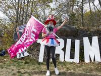 People dressed in political costumes participate in a contest during a Trump campaign rally named "Trumptoberfest" at Rocky Point Park in Warwick, Rhode Island on October 11, 2020. Many supporters dressed in political campaign clothing and waved flags while others dressed in festive costumes to take part in a political costume contest. Joseph Prezioso / AFP