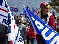 A contestant dressed as a Donald Trump Pokemon trainer participates in a Trump campaign rally named "Trumptoberfest" at Rocky Point Park in Warwick, Rhode Island on October 11, 2020. Many supporters dressed in political campaign clothing and waved flags while others dressed in festive costumes to take part in a political costume contest. Joseph Prezioso / AFP