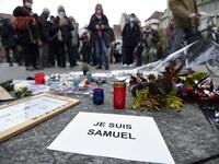Thousands of people rally in different French cities on October 18 in a show of solidarity and defiance after a teacher was beheaded for showing pupils cartoons of the Prophet Mohammed.  FREDERICK FLORIN / AFP