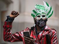 Protestors attend a demonstration outside the Nigerian High Commission against police brutality in Lagos in London on October 21, 2020. UN Secretary General Antonio Guterres called Wednesday for an end to what he called "brutality" by police in Nigeria, which has been rocked by two weeks of protests. Guterres said gunmen that opened fire on peaceful protesters Tuesday evening in Lagos caused "multiple deaths" and many injuries. DANIEL LEAL-OLIVAS / AFP