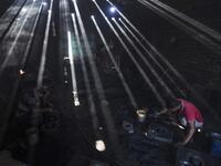 In this picture taken on November 16, 2020 dockyard workers prepare molds to make propeller at a workshop on the banks of the Buriganga river in Char Kaliganj on the outskirts of Dhaka. Rivers are the lifeblood of the delta nation of 168 million people where much of the low-lying land is accessed via boat, with Bangladesh's strong economic growth of recent years fuelling more investments in new and bigger ships. Munir UZ ZAMAN / AFP