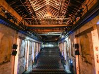 A picture taken on November 20, 2020 shows empty seats at the Geblaesehalle theater at the Landschaftspark Duisburg-Nord in Duisburg, western Germany. The Geblaesehalle is part of the steam blower house, a building complex from the founding phase of the former steelworks of August Thyssen and owns 1000 seats. No public events will take place at theaters until December, 2020 to limit the spread of the novel coronavirus. Ina FASSBENDER / AFP