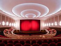 A picture taken on November 19, 2020 shows the closed red curtain at the Lichtburg cinema in Essen, western Germany. The Lichtburg, which was built 1928, is a historical cinema with 1250 seats and is the largest cinema hall in Germany. No public events will take place at theaters until December, 2020 to limit the spread of the novel coronavirus. Ina FASSBENDER / AFP