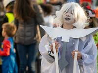 A child in costume for Halloween in Woodlawn Heights on October 31, 2020 in New York City. The CDC shared on their website alternative ways to still celebrate the holiday while being safe. David Dee Delgado/Getty Images/AFP