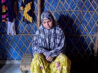 In this photograph taken on August 24, 2020, Rohingya refugee Somuda Begum pauses during an interview with AFP at Kutupalong refugee camp in Ukhia. Stay in a squalid refugee camp -- hopeless, starving, and made to feel a burden -- or leave, risking death, rape, human trafficking and months at sea to reach a husband you've never met. This is the bleak choice many Rohingya women, already scarred from fleeing persecution in Myanmar, are now facing. Munir UZ ZAMAN / AFP