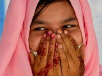 This photo taken on October 21, 2020 shows Rohingya refugee Amerah, 18, who said she has not seen her fiance -- who is a construction worker in Malaysia -- since she was six, at a temporary shelter in Lhokseumawe in Aceh province. Stay in a squalid refugee camp -- hopeless, starving, and made to feel a burden -- or leave, risking death, rape, human trafficking and months at sea to reach a husband you've never met. This is the bleak choice many Rohingya women, already scarred from fleeing persecution in Myan