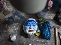 A puppet head lies on a workbench at the " Alfa Theatre" laboratory in Turin, on November 30, 2020. The Grilli family has a collection of more than 20,000 objects from around the world, everything from theatres, marionettes and glove puppets to shadow figures and silhouettes. A long-time dream of Grilli and his wife Mariarosa, 78, the museum is due to open in 2023 in Turin, financed both privately and publicly with the help of different institutions.  Marco Bertorello / AFP