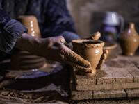 Petros was only a teenager when he had to take over for his sick father and become the main potter of the family. He has since become a master of the craft, and is keen to pass his skills on.  Delil SOULEIMAN / AFP
