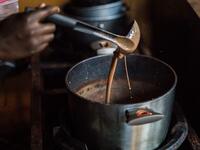 Preparation of hot chocolate drink is done in the workshops of Makaya Chocolat on December 23, 2020 in Petionville, Haiti. Although small in the face of South America's giants, Haiti is slowly developing its cocoa industry to ensure better incomes for thousands of modest farmers and to end the stereotype of gastronomic art known as the domain of wealthy countries. Valerie Baeriswyl / AFP