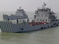 Rohingya refugees are seen on Bangladesh Navy ships as they are relocated to the controversial flood-prone island Bhashan Char in the Bay of Bengal, in Chittagong on December 29, 2020. REHMAN ASAD / AFP