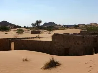 This picture taken on December 31, 2020, shows the walls of an abandoned house in the Omani village of Wadi al-Murr, about 400 kms (250 miles) southwest of the capital Muscat. Encroaching desert sands have left little evidence that Wadi al-Murr ever existed, but former inhabitants, while resigned to its destruction, are trying to preserve its memory. MOHAMMED MAHJOUB / AFP