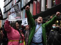 Supporters of Wikileaks founder Julian Assange celebrate outside the Old Bailey court in central London after a judge ruled that Assange should not be extradited to the United States to face espionage charges for publishing secret documents online on January 4, 2021. DANIEL LEAL-OLIVAS / AFP