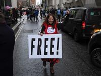 Supporters of Wikileaks founder Julian Assange celebrate outside the Old Bailey court in central London after a judge ruled that Assange should not be extradited to the United States to face espionage charges for publishing secret documents online on January 4, 2021. DANIEL LEAL-OLIVAS / AFP