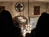 Sudanese Copts attend Christmas midnight mass at the capital Khartoum's Martyrs Church late on January 6, 2021, as the Orthodox Christian faith uses the old Julian calendar in which Christmas falls 13 days after the date in the more widespread Gregorian calendar.  Ebrahim HAMID / AFP