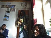 In this photo taken on January 9, 2021, Hazara armed militia for the Resistance for Justice Movement, stand inside their base ahead of a patrol against Taliban insurgents at Hisa-e-Awali Behsud district of Maidan Wardak Province. Comprising roughly 10 to 20 percent of Afghanistan's 38-million population, Hazaras have long been persecuted for their largely Shiite faith by Sunni hardliners in a country wracked by deep ethnic divisions. WAKIL KOHSAR / AFP