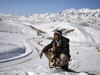 In this photo taken on January 9, 2021, a Hazara armed militia for the Resistance for Justice Movement, keeps watch during a patrol against Taliban insurgents at Hisa-e-Awali Behsud district of Maidan Wardak Province. Comprising roughly 10 to 20 percent of Afghanistan's 38-million population, Hazaras have long been persecuted for their largely Shiite faith by Sunni hardliners in a country wracked by deep ethnic divisions. WAKIL KOHSAR / AFP