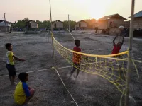 This photo taken on January 11, 2021 shows Chin children playing in Bethel village in Hmawbi, on the outskirts of Yangon, where hundreds of members of the Chin ethnic community have settled after being displaced by fighting between Myanmar's military and the Arakan Army in the country's north.  Ye Aung THU / AFP