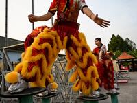 This photograph taken on January 20, 2021 shows female dancers taking part in a practice session at the Tu Anh Duong lion and dragon dance school in Can Tho city in southern Vietnam's Mekong Delta. Manan VATSYAYANA / AFP