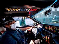This picture taken on January 31, 2021 shows car enthusiast Masamune Isogai, who works for a logistics company in sales, driving a 1991 Trans Am Knight Rider in Urayasu, an eastern suburb of Tokyo. A loose club of fans rolls up most weekends in central Tokyo to show off their Cadillacs, Chevrolets and other modern classic vehicles from the mid to late 20th century. Philip FONG / AFP