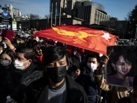 Myanmar activists chant slogans during a protest outside the United Nations University building in Tokyo on February 1, 2021, after Myanmar's military seized power in a bloodless coup and detaining democratically elected leader Aung San Suu Kyi as it imposed a one-year state of emergency. Philip FONG / AFP