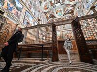 People visit the Sistine Chapel on the reopening day of the Vatican museum on February 1, 2021 in Vatican City, as the city-state eases its closure aimed at curbing the spread of the COVID-19 infection, caused by the new coronavirus. Andreas SOLARO / AFP