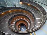 A man walks down the Bramante Staircase as he visits the Vatican museum on its reopening day, on February 1, 2021 in Vatican City, as the city-state eases its closure aimed at curbing the spread of the COVID-19 infection, caused by the new coronavirus. Andreas SOLARO / AFP