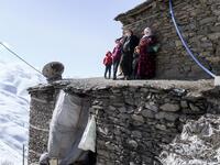 n this photograph taken on February 15, 2021, Kurdish villagers look at members of the Bahcesaray public hospital vaccination team as they arrive at the village of Guneyyamac in eastern Turkey, as part of an expedition to vaccinate residents of 65 years old or above with Sinovac's CoronaVac Covid-19 vaccine. Turkey's population of more than 83 million is spread out across Europe and Asia and covers some seemingly impregnable terrain. The vaccination effort with China's CoronaVac jab kicked off with a bang i