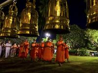 Buddhist monks lead a candlelight procession around Wat Traphang Thong to celebrate Makha Bucha Day in Sukhotai on February 26, 2021. Mladen ANTONOV / AFP