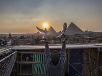 Omar Gamal, a 28-year-old pigeon keeper, releases his pigeon 