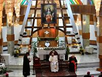 Pope Francis (C) visits Baghdad's Syriac Catholic Cathedral of Our Lady of Salvation 