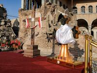  a view of (L to R) of Latin and Chaldean crosses placed upon a platform where Pope Francis is due to speak 
