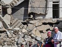 Pope Francis (R), accompanied by the Chaldean Catholic Archbishop of Mosul Najib Michaeel Moussa 