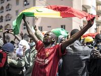 A supporter of main opposition candidate, Ousmane Sonko, reacts in protest outside the Justice Palace in Dakar on March 8, 2021. Protests have been ongoing after the Senegal opposition leader Ousmane Sonko was arrested following rape charges. JOHN WESSELS / AFP