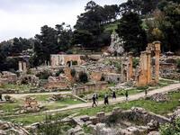 People walk through the remains of the Sanctuary of Apollo in the ruins of Libya's eastern ancient city of Cyrene 