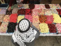 A Palestinian street vendor sells candy and sweets in Hebron's Old City in the Israeli-occupied West Bank 
