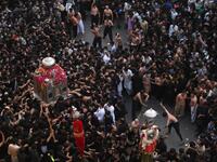 Shiite Muslim devotees take part in a procession 
