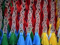 Performers dance as they take part in a Cultural Performance as part of the celebration of the 100th Anniversary of the Founding of the Communist Party of China, at the Bird's nest national stadium in Beijing on June 28, 2021. The 100th anniversary is scheduled 