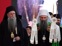 Serbian Orthodox Church's patriarch Porfirije (R) and bishop Joanikije (L) walk through the crowd gathered in front of the orthodox cathedral in Podgorica, on September 4, 2021, to celebrate and show support for the enthronement of the new bishop of the Serbian Orthodox Church in Montenegro. autocephaly.