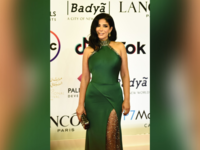 Egyptian actress Mona Zaki poses on the red carpet during the opening of the 43rd edition of the Cairo International Film Festival (CIFF) at the Cairo Opera House in the Egyptian capital on November 26, 2021. (Photo by Sayed HASAN / AFP)