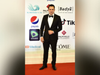 Tunisian actor and former footballer Dhafer L'Abidine poses on the red carpet during the opening of the 43rd edition of the Cairo International Film Festival (CIFF) at the Cairo Opera House in the Egyptian capital on November 26, 2021. (Photo by Sayed HASAN / AFP)