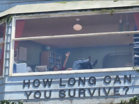 Netflix traps a real man inside giant billboard to promote new thriller