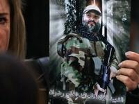 A Lebanese woman carries a portrait of of slain Hezbollah military leader Imad Mughnieh as she attends a gathering for a televised speech held by the Shiite party in the capital Beirut, commemorating the party's killed leaders, on February 16, 2018. 
(JOSEPH EID / AFP)